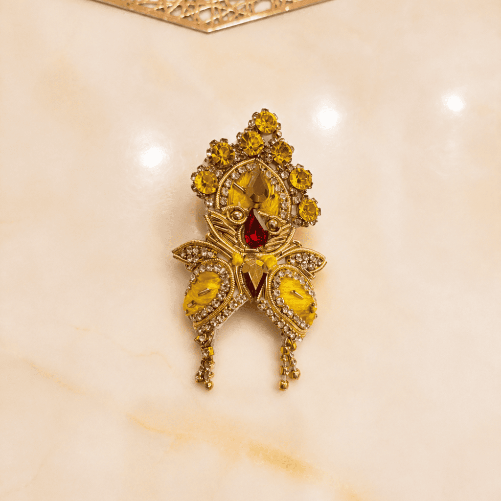 Bhavyaam Pitambar Vaibhav Poshak for Ladoo Gopal Ji featuring a handcrafted yellow designer dress with pearl embroidery, kundan embellishments, floral detailing, and a matching royal mukut.