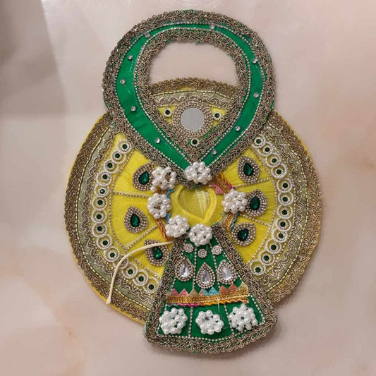 Handcrafted sunny yellow and emerald green designer dress and matching fan-shaped crown for Ladoo Gopal Ji, featuring pearl flowers and gemstones.