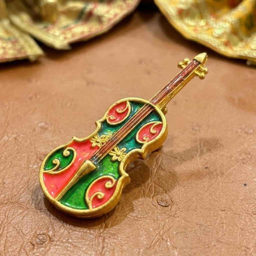 Sur-Sangeet miniature violin accessory for Ladoo Gopal Ji, featuring emerald and ruby enamel with gold-tone floral details