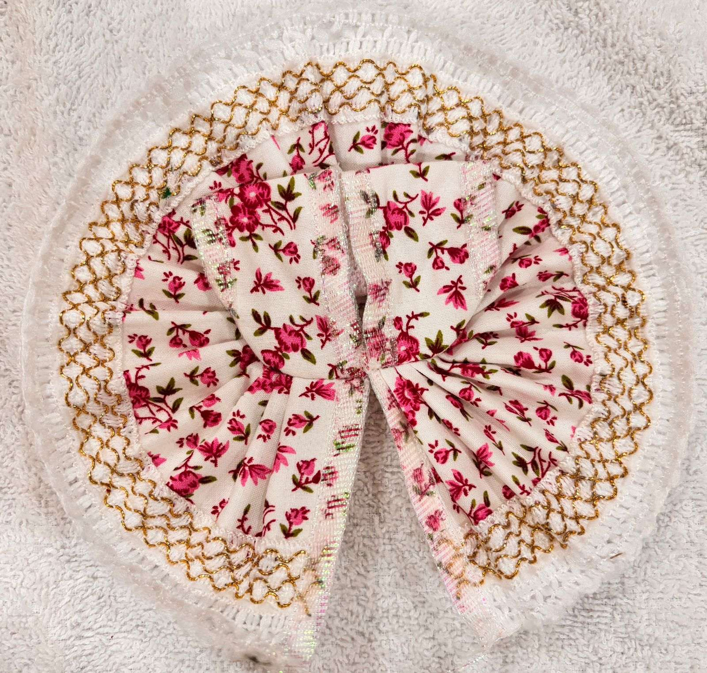 Floral patterned scrunchie on a textured surface