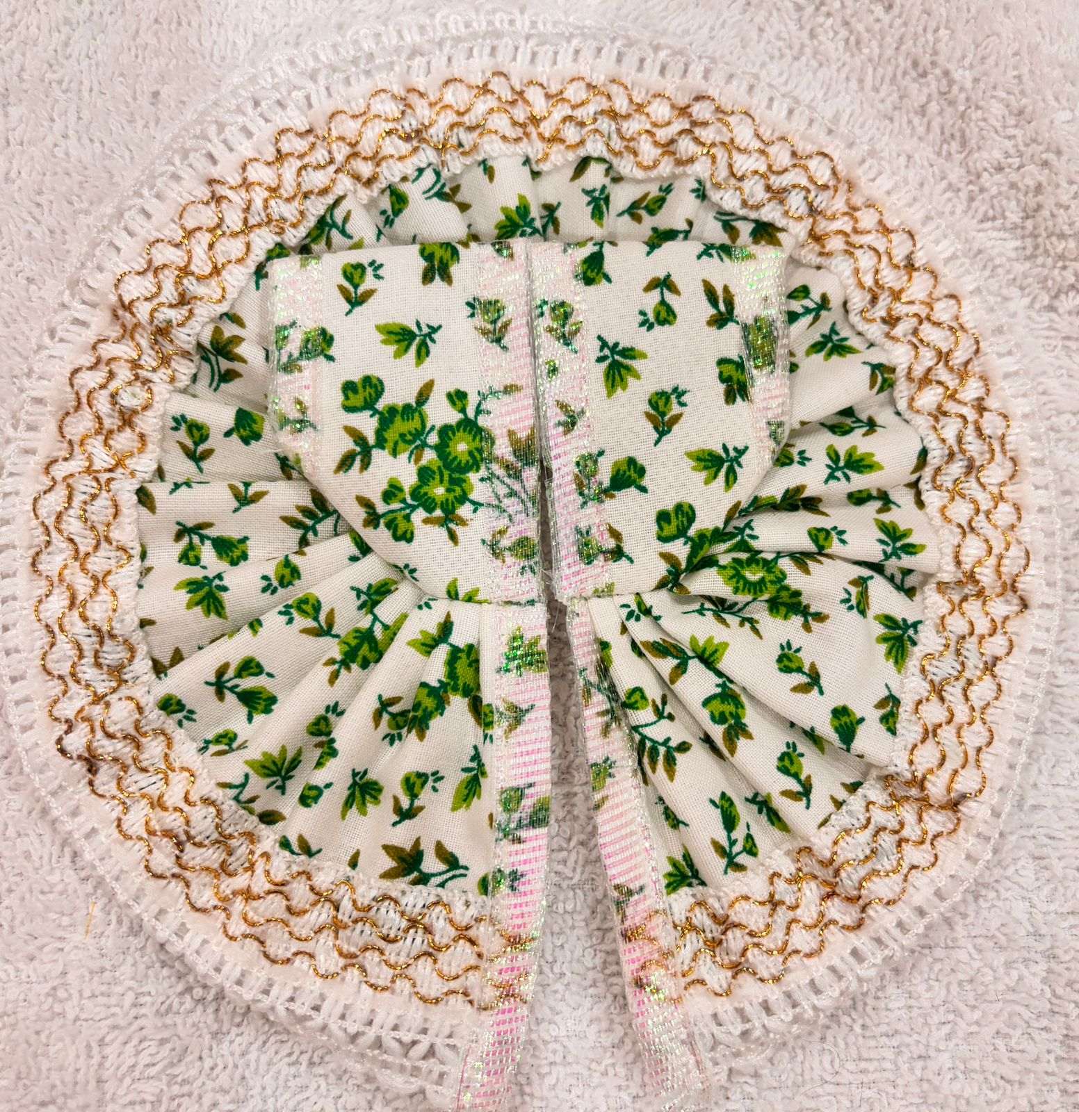 Decorative doily with floral pattern on a textured surface