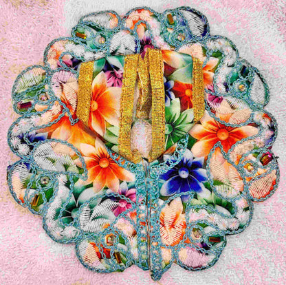 Decorative butterfly with floral patterns and gold accents on a textured background