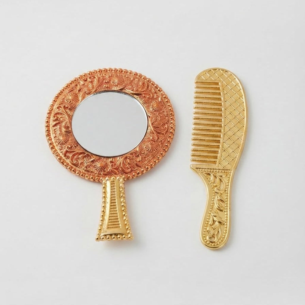Ornate circular handheld mirror with a floral red-gold frame paired with a matching gold-finish decorative comb for Ladoo Gopal Ji