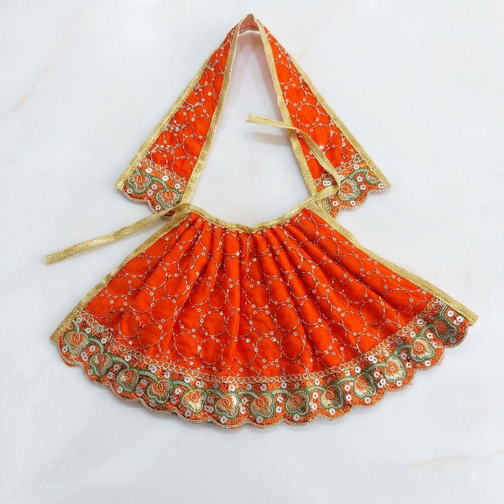 Bhavyaam handcrafted Kesari orange Mata Rani lehenga patka set with golden zari, sequin circles, and scalloped floral border for Navratri and Devi shringar.