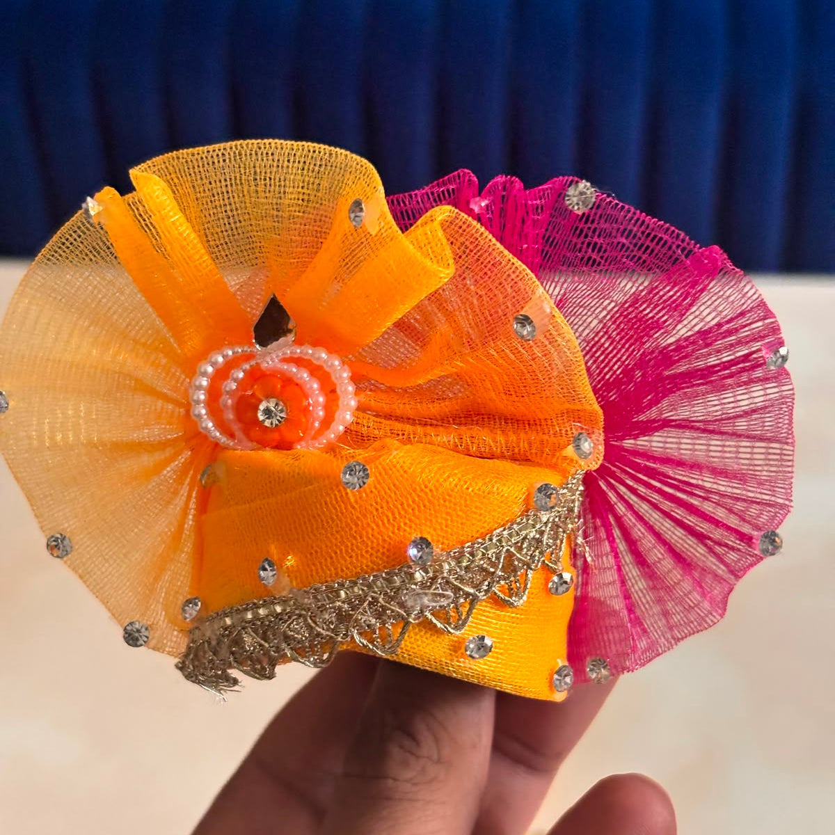 Bhavyaam Kesari Rangotsav handcrafted saffron orange and rani pink Laddu Gopal Ji poshak with pearl, stone work and matching designer Mukut for Janmashtami and Rajbhog seva.
