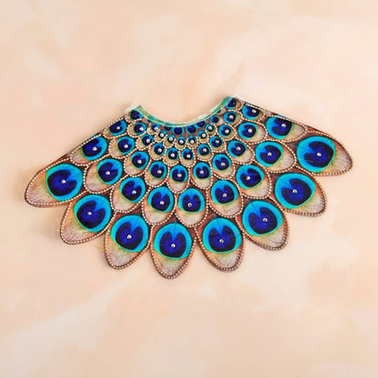 Bhavyaam Mayur Vaibhav handcrafted Lehnga Patka set for Mata Rani, Lakshmi Ji and Ganesh Ji featuring a peacock feather inspired design with stone embellishments and festive shringar.