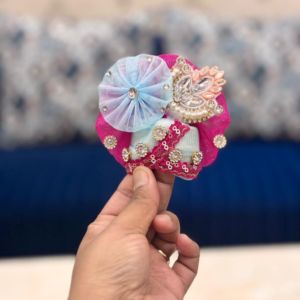 Bhavyaam Neelkamal handcrafted sky blue and rani pink Laddu Gopal Ji poshak with pearl, kundan and stone work and matching designer Mukut for Janmashtami and Jhulan Yatra.