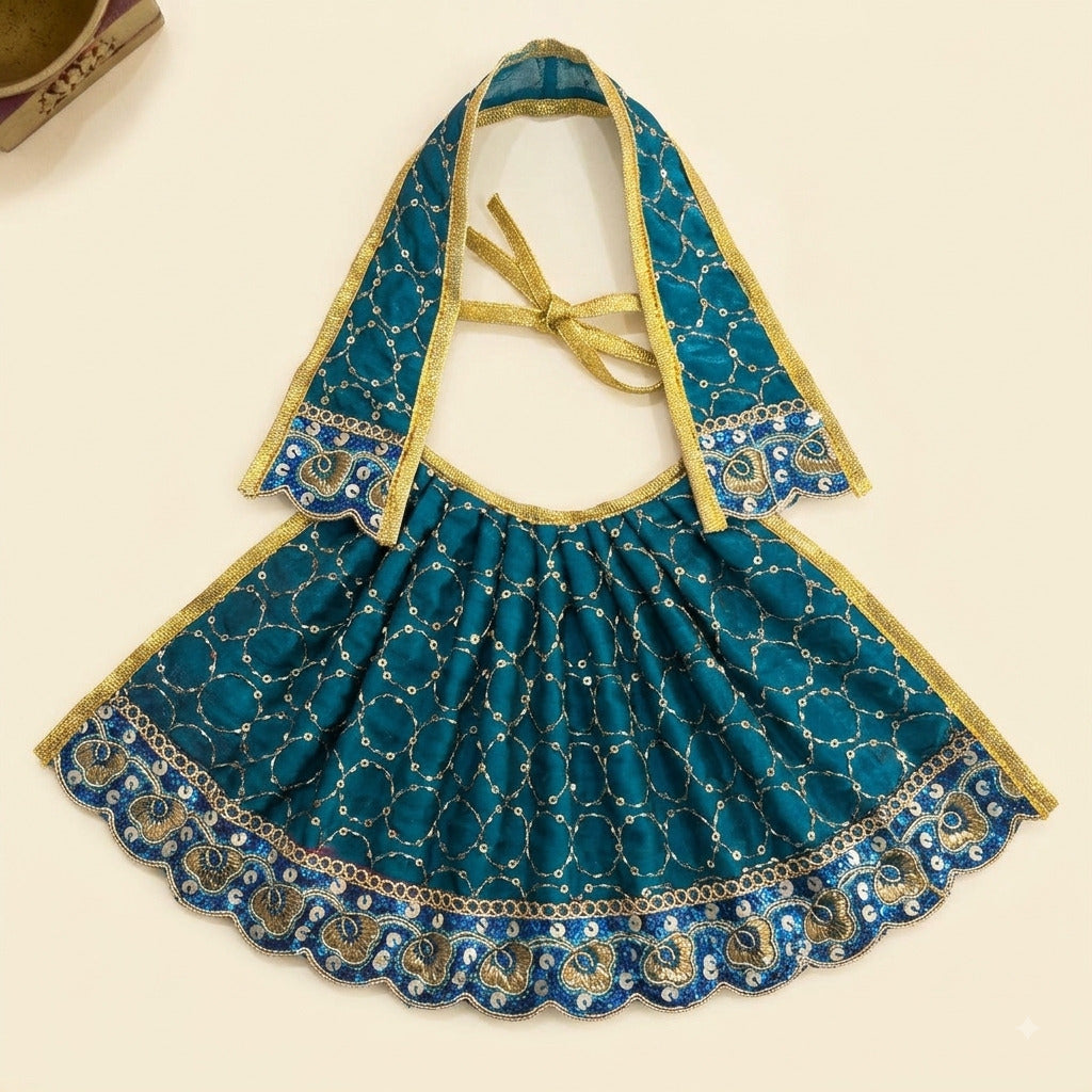 Bhavyaam handcrafted peacock teal blue Mata Rani lehenga patka set with golden zari embroidery, sequin circles, and scalloped blue floral border for Navratri and Devi shringar.