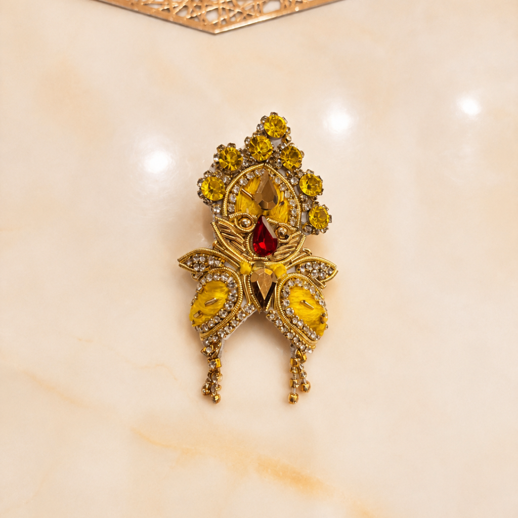 Bhavyaam Pitambar Vaibhav Poshak for Ladoo Gopal Ji featuring a handcrafted yellow designer dress with pearl embroidery, kundan embellishments, floral detailing, and a matching royal mukut.