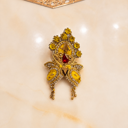Bhavyaam Pitambar Vaibhav Poshak for Ladoo Gopal Ji featuring a handcrafted yellow designer dress with pearl embroidery, kundan embellishments, floral detailing, and a matching royal mukut.