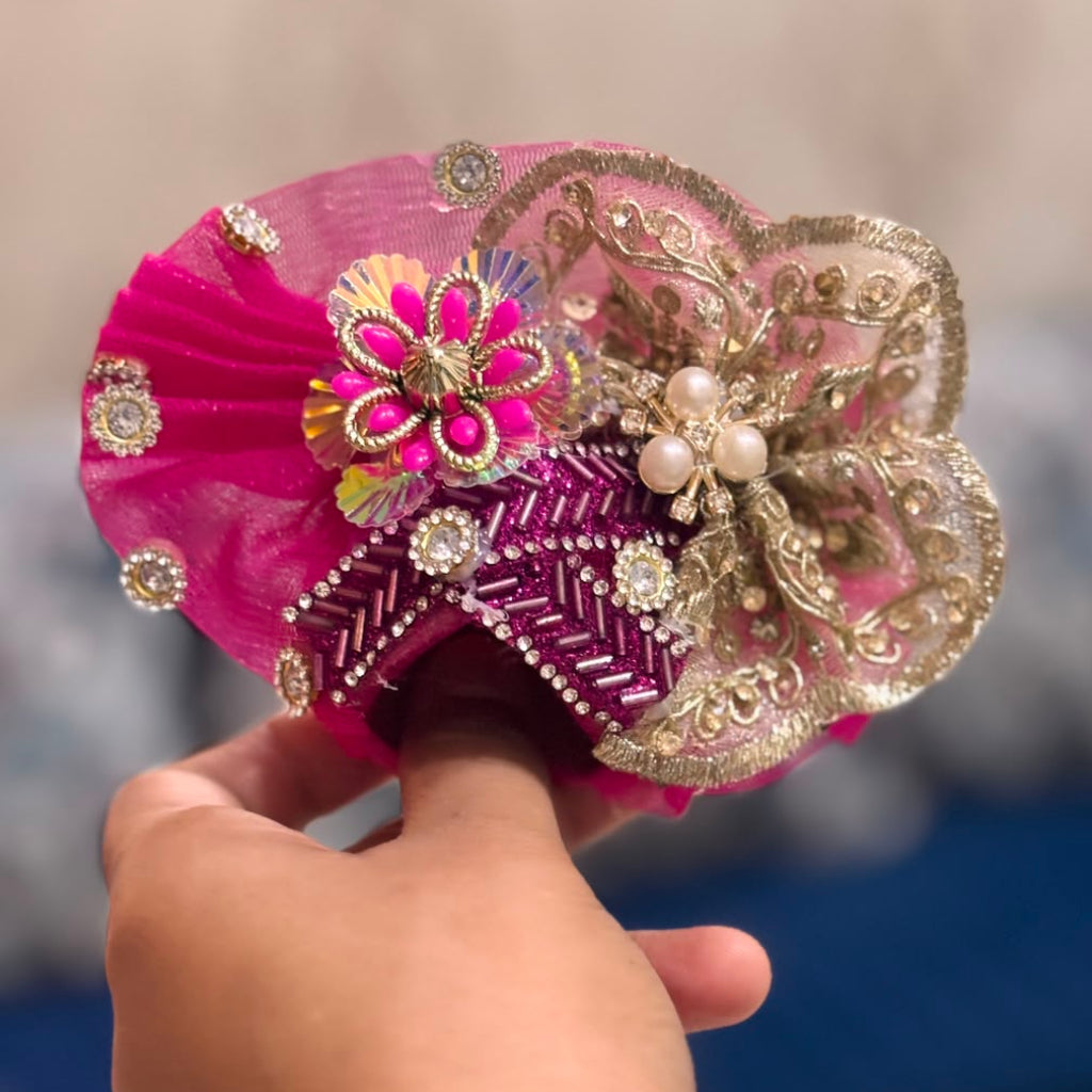Handcrafted wine pearl Laddu Gopal Ji Poshak with designer Mukut by Bhavyaam featuring royal embroidery and premium Shringar.