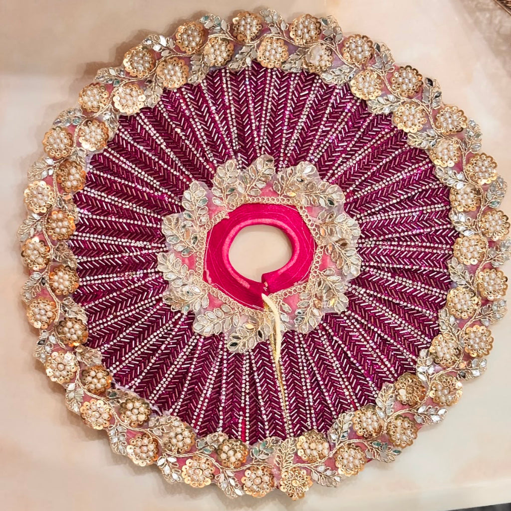 Handcrafted wine pearl Laddu Gopal Ji Poshak with designer Mukut by Bhavyaam featuring royal embroidery and premium Shringar.