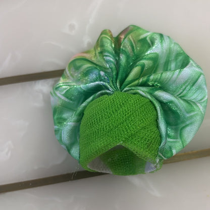 Green textured object on a white background