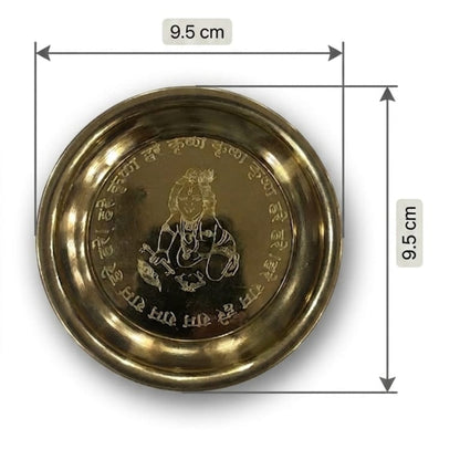 Brass plate with engraved design and measurements on a white background