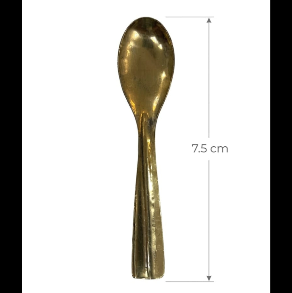 Gold spoon with measurement label on a white background