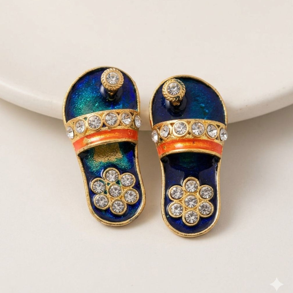 Designer emerald and ruby-red enamel charan paduka for Ladoo Gopal Ji with crystal floral embellishments