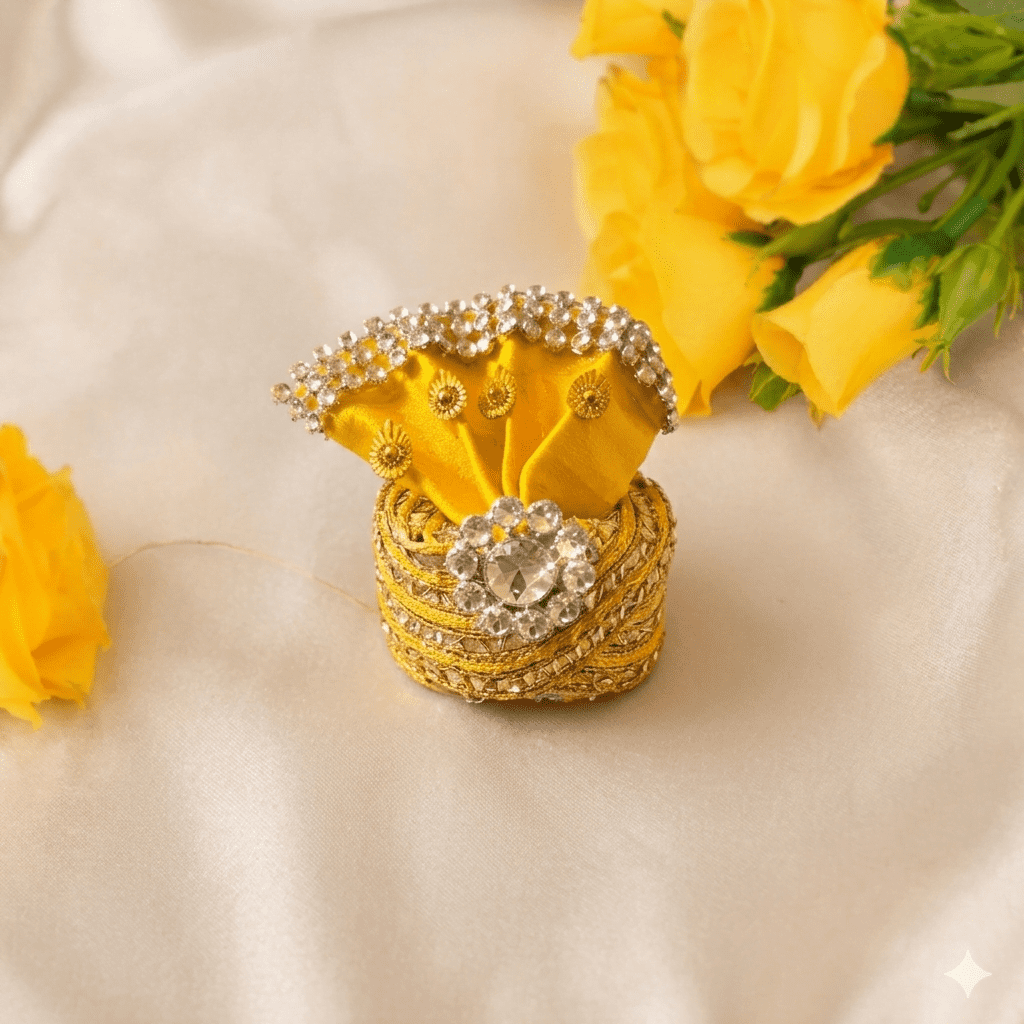 Decorative yellow box with embellishments on a beige surface with yellow flowers.
