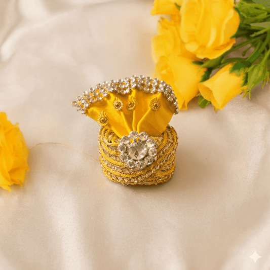 Decorative yellow box with embellishments on a beige surface with yellow flowers.
