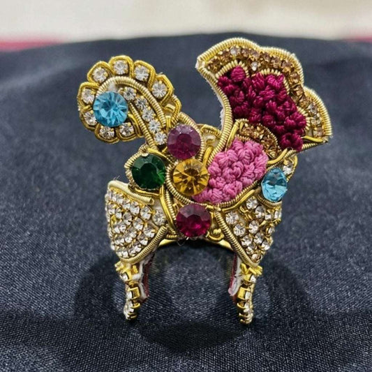 Vibrant multi-colored stone designer mukut for Ladoo Gopal Ji with floral threadwork and gold detailing.
