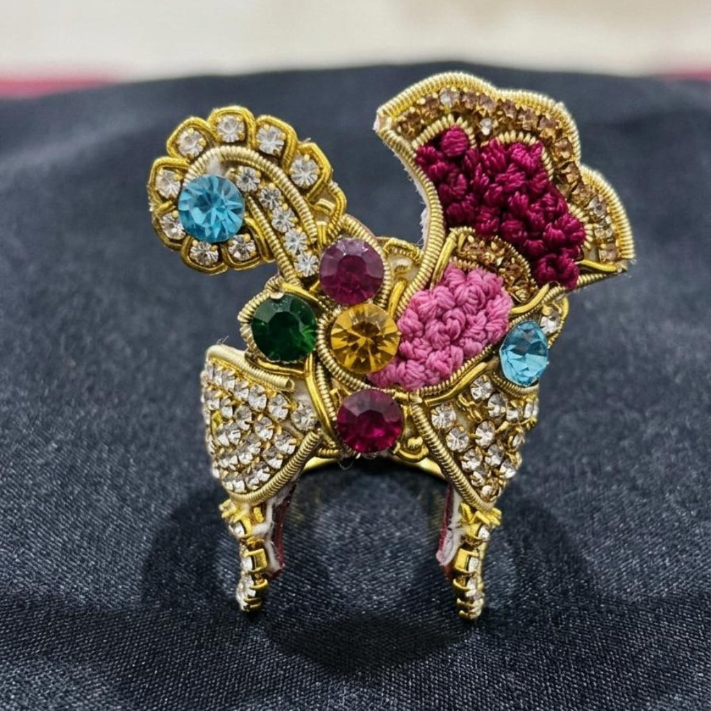 Vibrant multi-colored stone designer mukut for Ladoo Gopal Ji with floral threadwork and gold detailing.