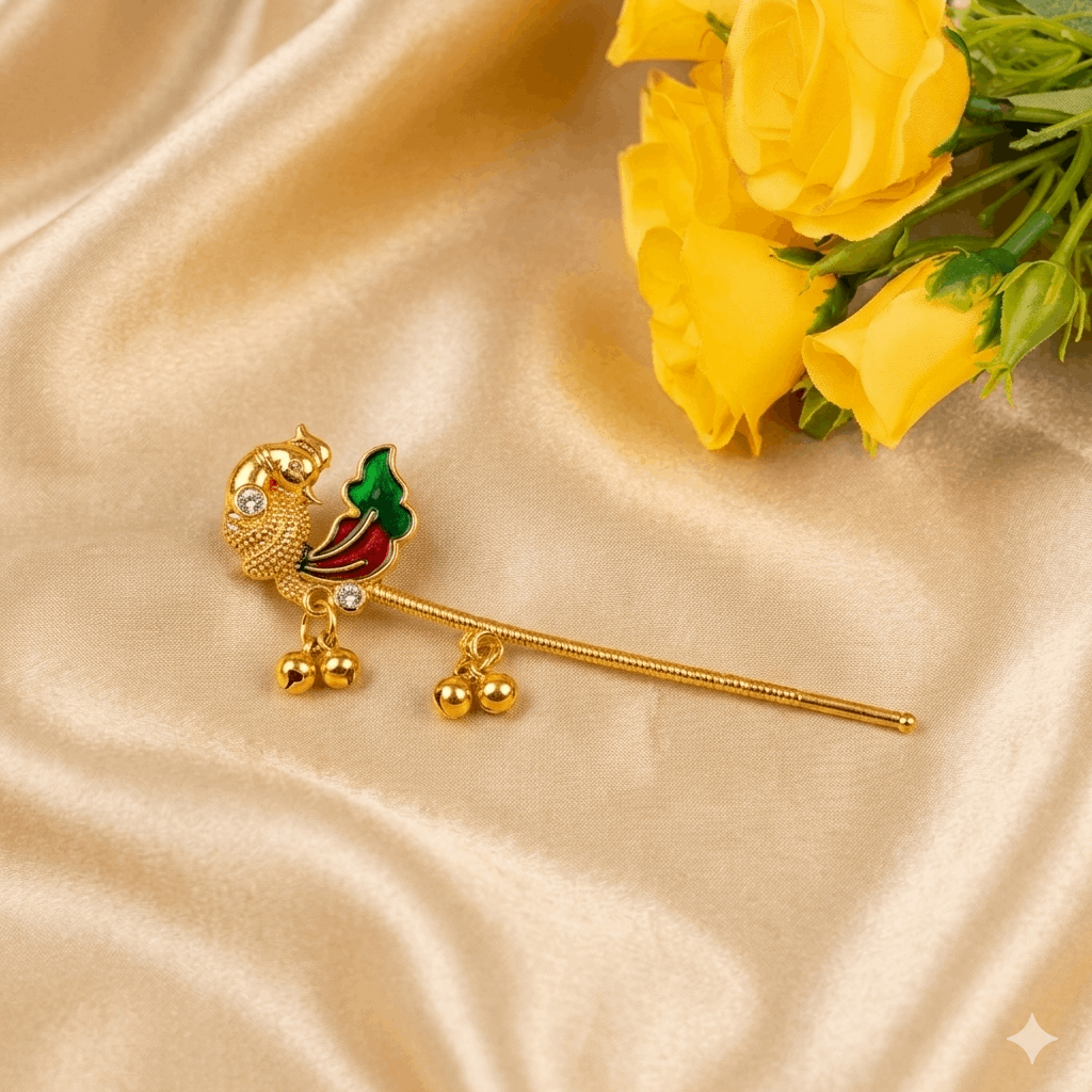 Gold Bansuri with bird design on a satin surface with yellow flowers