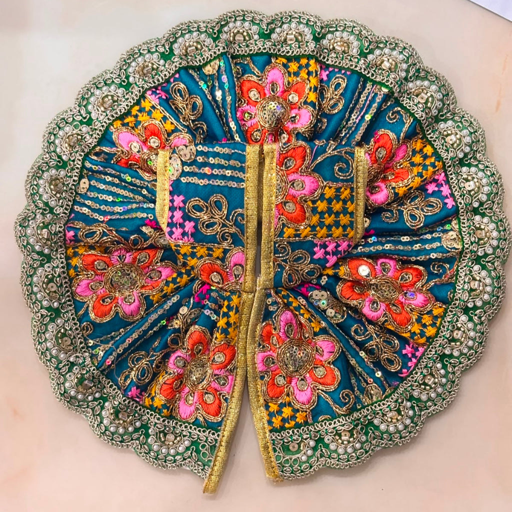 Handcrafted vibrant  teal green designer dress and matching crown for Ladoo Gopal Ji, featuring multi-colored thread embroidery and pearl borders.