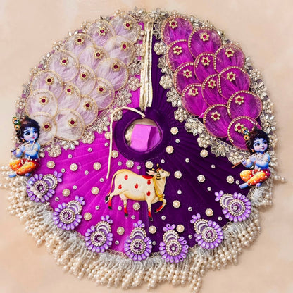 Handcrafted royal purple designer dress and matching crown for Ladoo Gopal Ji, featuring sacred cow appliqué, Krishna motifs, and pearl fringes.